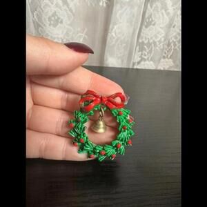 Vintage Festive Wreath Pin with Bell and Red Bow